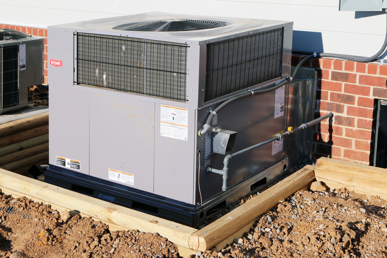 Exterior view of a packaged HVAC unit installed on a home.